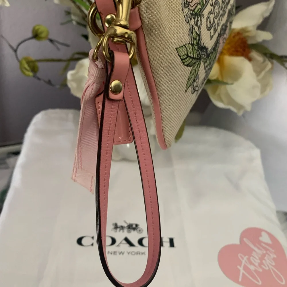 Limited Edition Coach Floral Canvas Wristlet Leather Trim and Bow
Charm - Picture 9 of 9